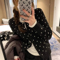 Women's grey knitted cardigan with crochet flower details, loose fit, long sleeves