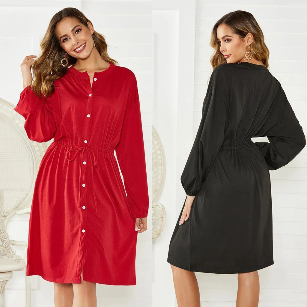 Black A-line dress with elastic waist, long sleeves with elastic cuffs and matching belt