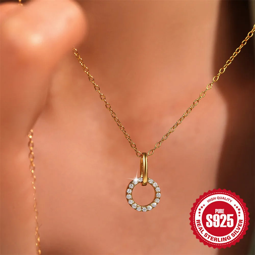 Gold tone S925 sterling silver adjustable clavicle chain necklace with a geometric interlocking zircon pendant.