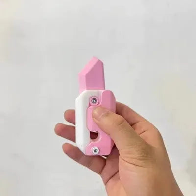 3D printed gravity carrot fidget knife in orange, purple and green colour on white background