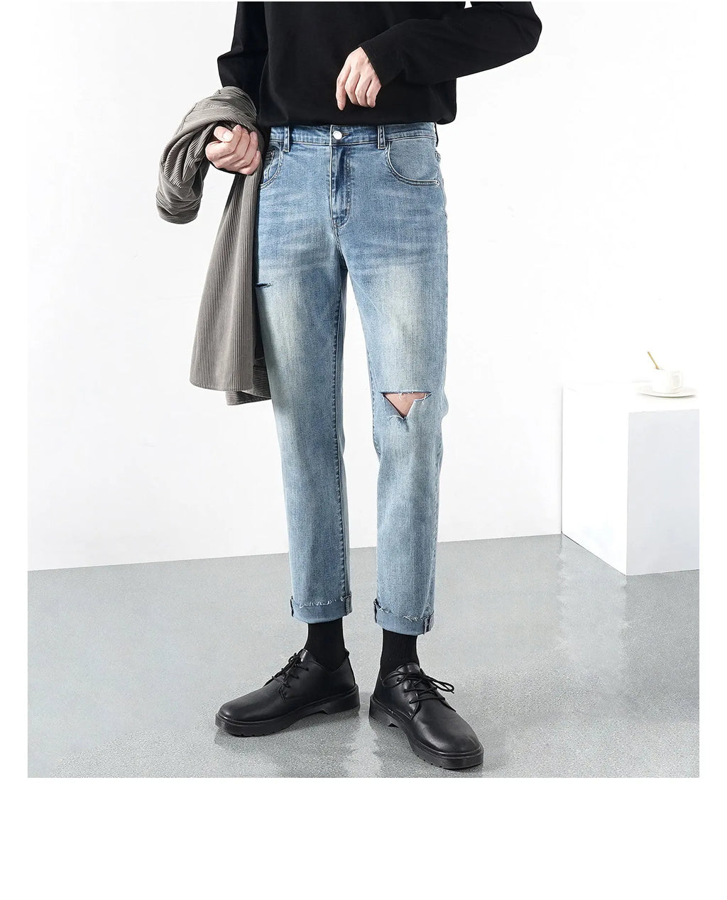 Men's light summer ripped jeans in blue with microelastic stretch denim, front view