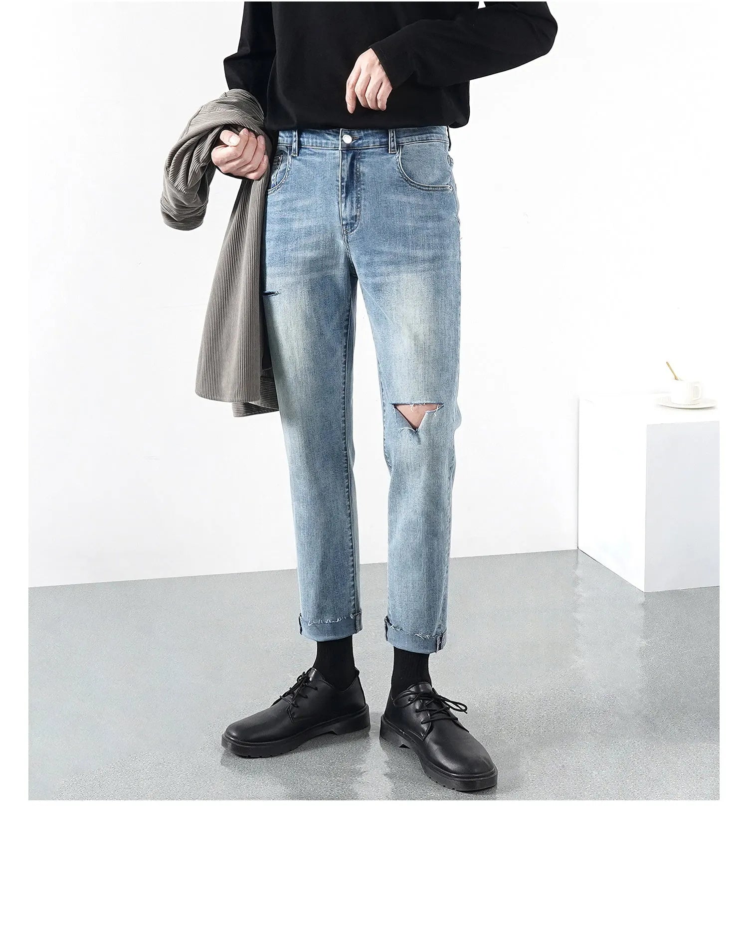 Men's light summer ripped jeans in blue with microelastic stretch denim, front view