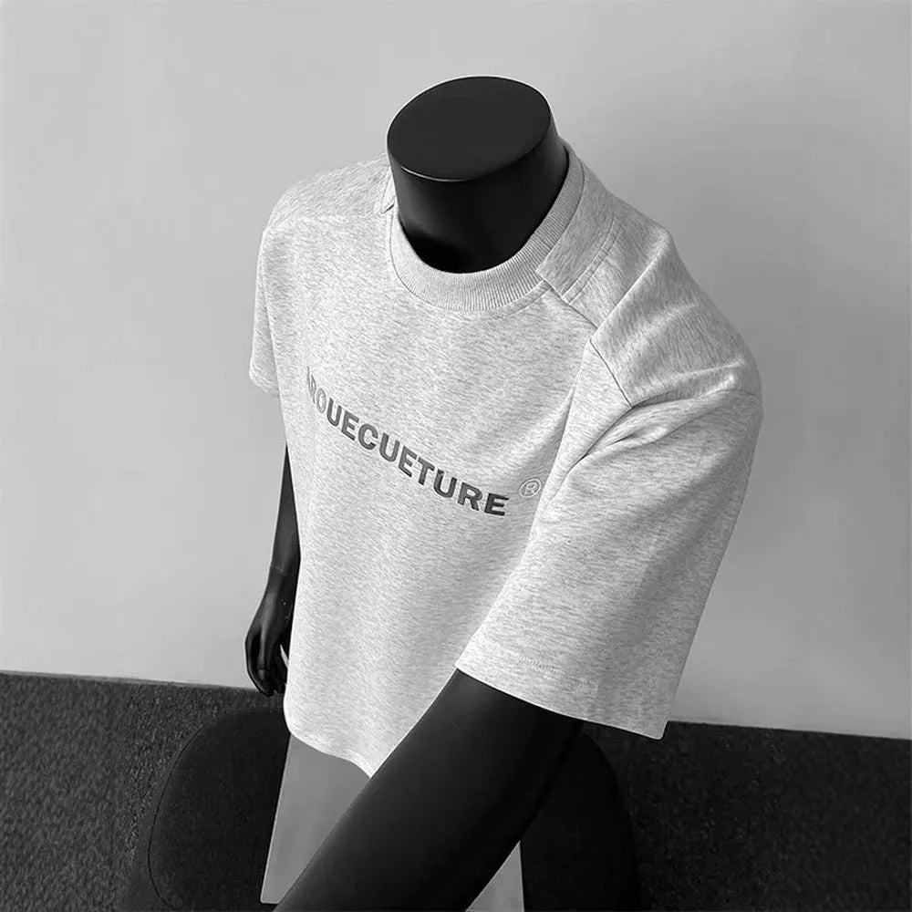 Men's short sleeve cotton shirt in loose pullover style available in black, white, and light grey