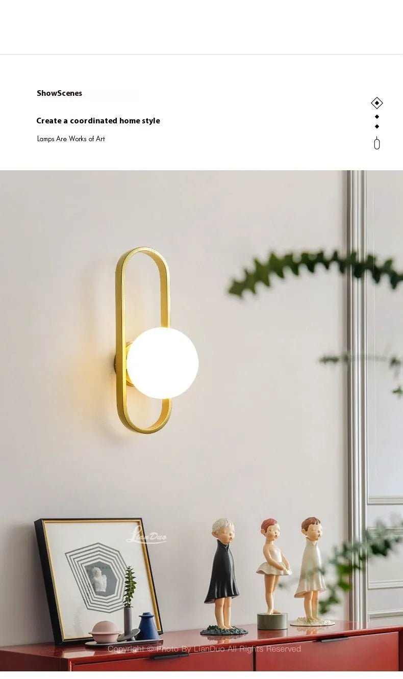 Minimalist modern wall lamp with iron body and glass shade in black or gold finish.
