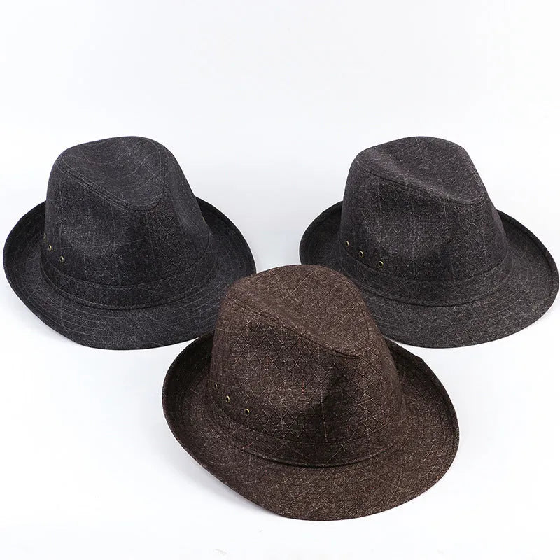 Classic brown fedora hat for men on a stand, showing the brim and structured crown.