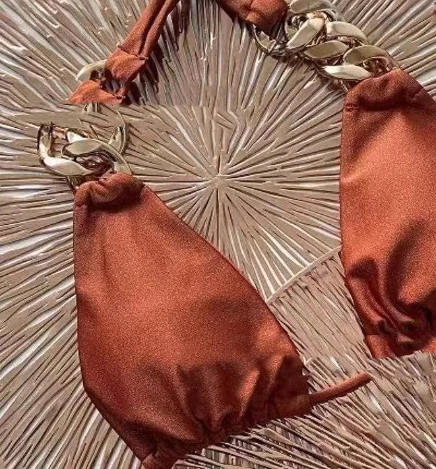 Brown women's bikini swimsuit with tube-top ring tether design and split high-cut legs