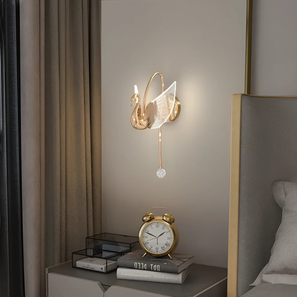 Gold swan-shaped wall lamp with iron construction and acrylic shade