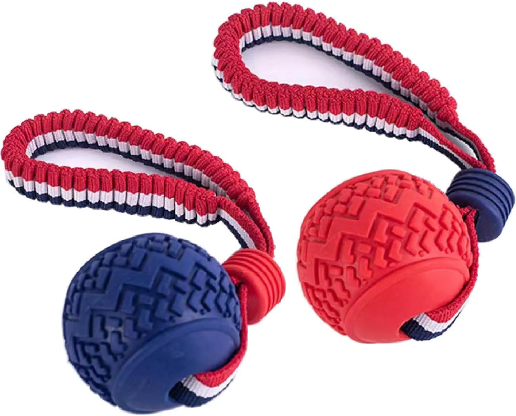Blue natural rubber dog ball attached to a rope toy for small breeds, showing textured surface.