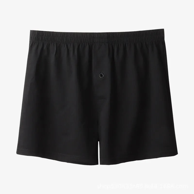 Men's high waist cotton boxer shorts in loose fitting design showing solid colour options