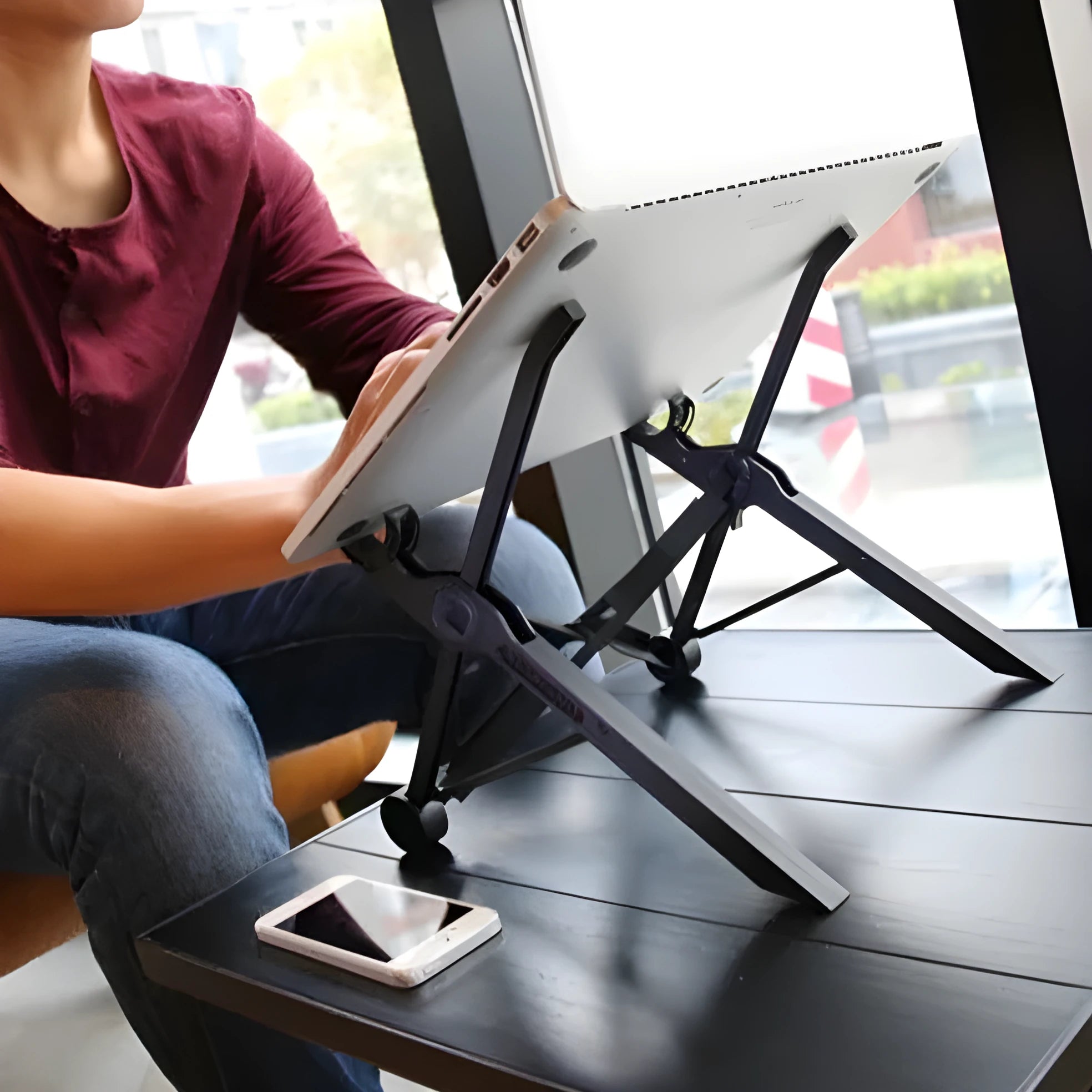 Folding portable laptop stand in sagacious black showing 40 cm width and folded position