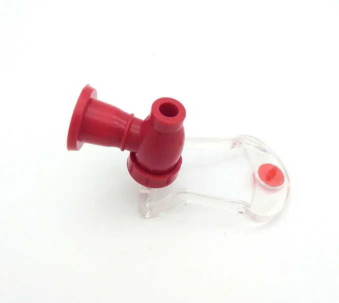 Red plastic Magic Tap soda dispenser mounted on inverted 2-litre bottle