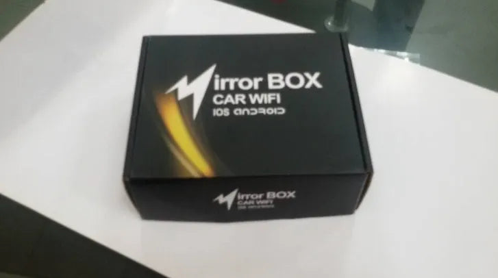 Black car mirror link WiFi box with power cable, antenna, AV cable and manual for smartphone screen mirroring.