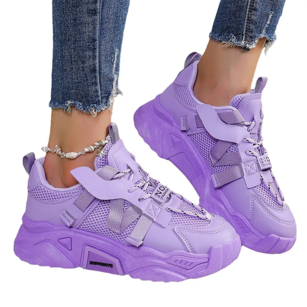 Women's purple platform mesh dad shoes with lace-up front, shown on a fitness floor.