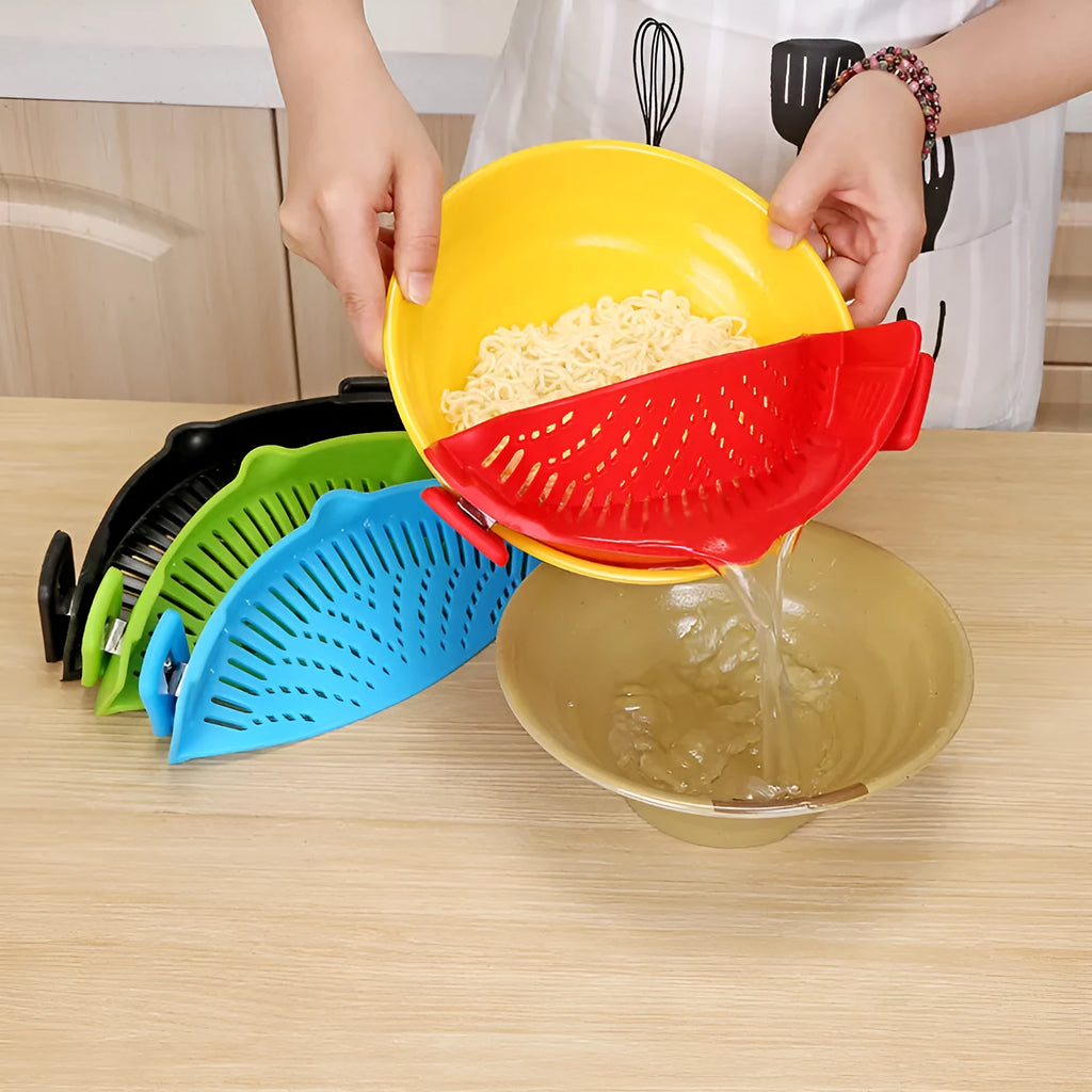 Silicone clip-on pot strainer with uniform hollow design in Red, attached to a stainless steel pot rim