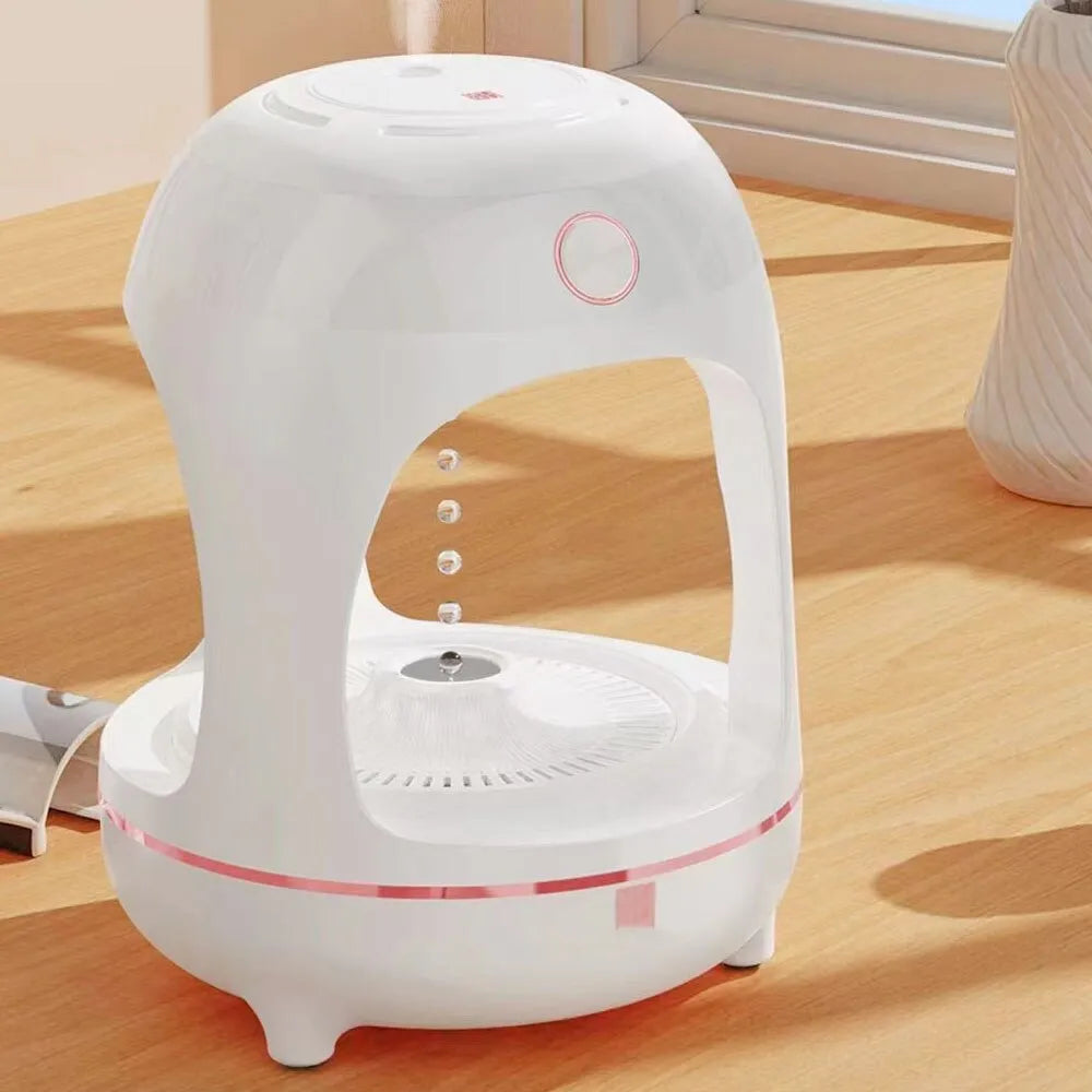 Anti gravity levitating water drops ultrasonic humidifier with LED night light in rose gold and white on a desk