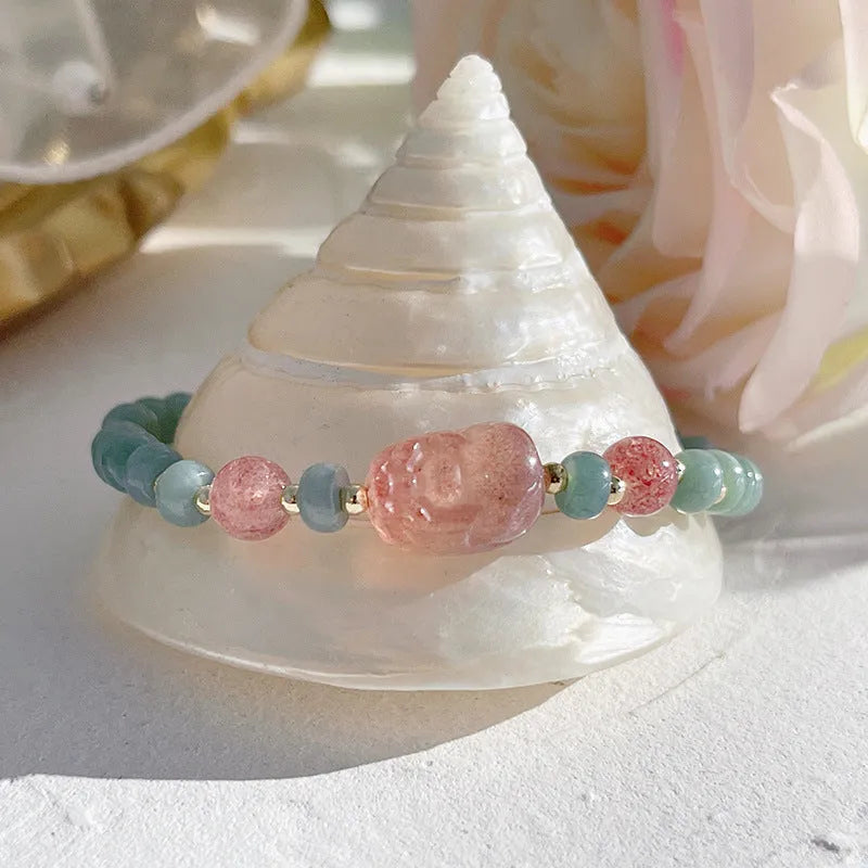 Natural blue water jade bead bracelet with gourd peace buckle design on white background