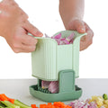 Green multifunctional vegetable chopper with hand pressure mechanism for cutting onions, potatoes, and cucumbers