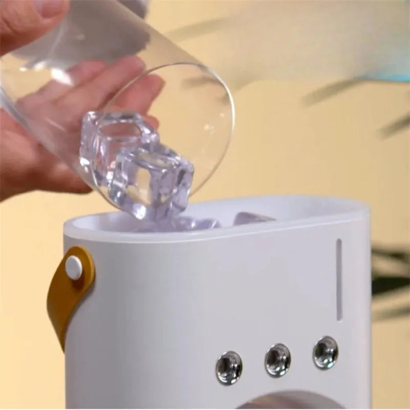 White double-ended spray fan with humidifying mist and remote control on a desk