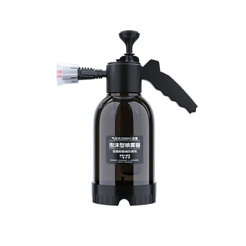 Black 2L foam watering can sprayer with handle and two nozzle attachments on a white background