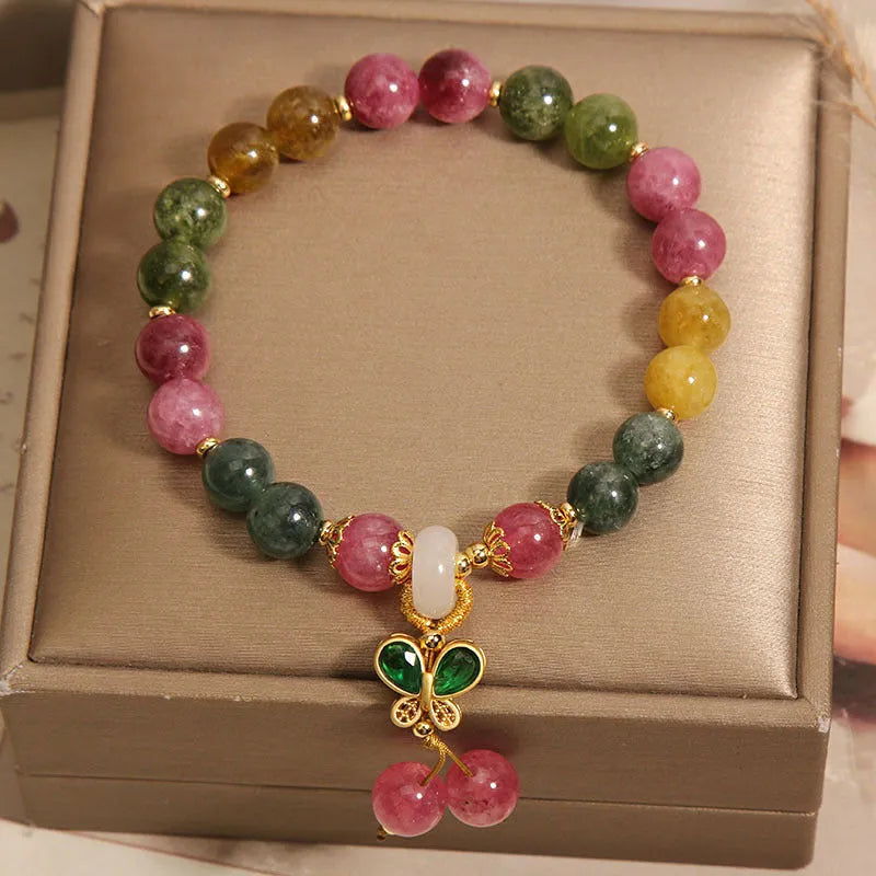 Colourful tourmaline butterfly pendant bracelet with alloy inlay and rhinestone accents on women's wrist