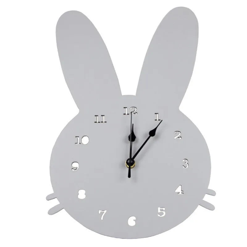 Wooden cartoon wall clock with playful design, such as a rabbit or alien, showing colour options and battery compartment.