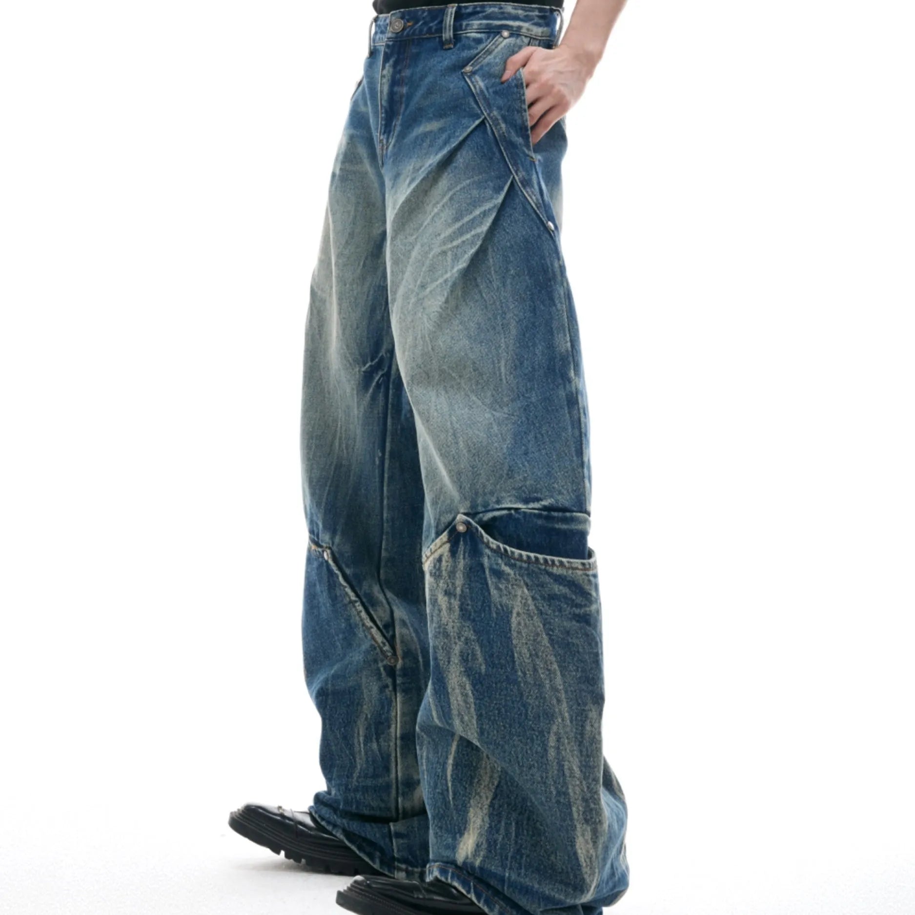 Men's verdant blue jeans with washed burst pattern and curved knife design detail