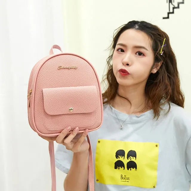 Black PU leather small women's backpack with zipper, shown as a shoulder bag