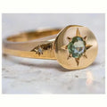 Gold coloured adjustable ring with star-shaped asterism zircon detail and micro inlay treatment