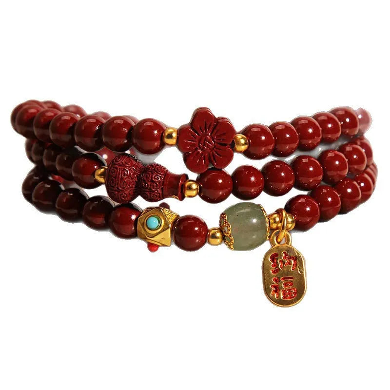 Polished cinnabar gourd five petal flower bracelet 6mm multi-circle on display