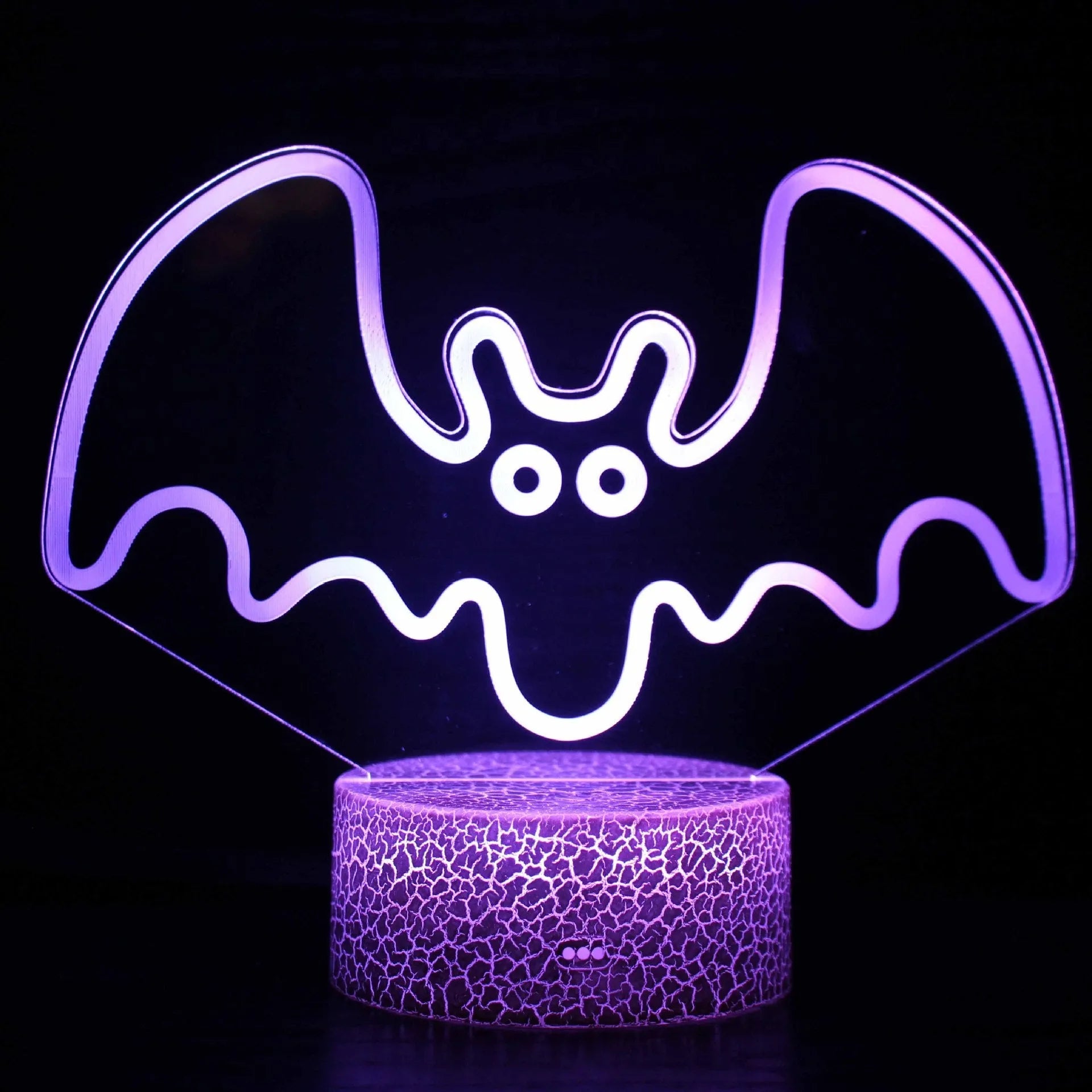 Small colourful acrylic 3D USB table lamp with touch control and crack base design on a desk.