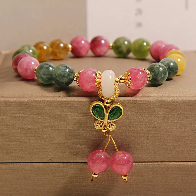 Colourful tourmaline butterfly pendant bracelet with alloy inlay and rhinestone accents on women's wrist
