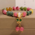 Colourful tourmaline butterfly pendant bracelet with alloy inlay and rhinestone accents on women's wrist
