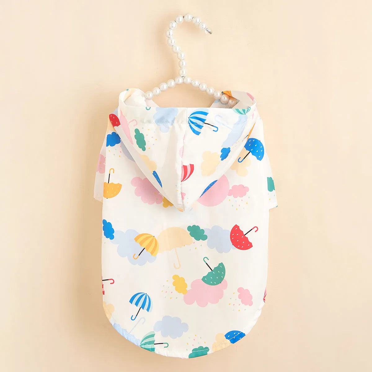 Dog wearing cartoon umbrella pattern polyester raincoat in waterproof fabric