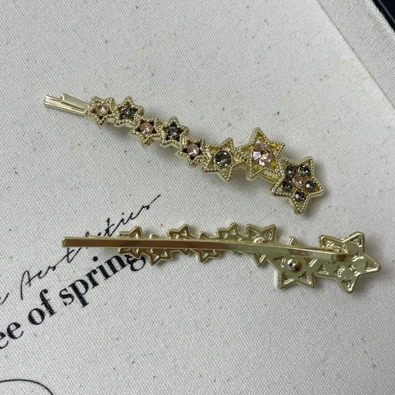 Gold colour alloy hair barrettes with broken clip design and five-pointed star decoration