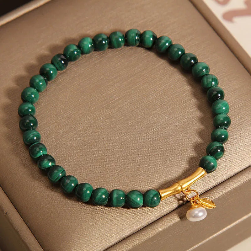 Women's lucky bamboo bracelet with white crystal beads on adjustable gold-toned chain