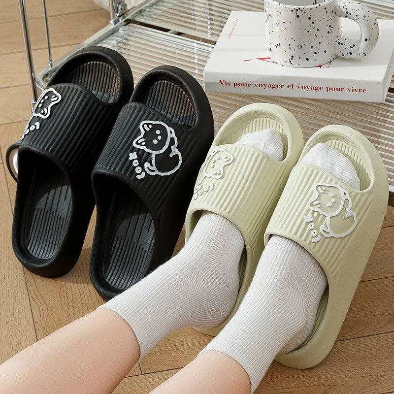 Green EVA platform slippers with a cat design on the upper, showing the thick non-slip sole.