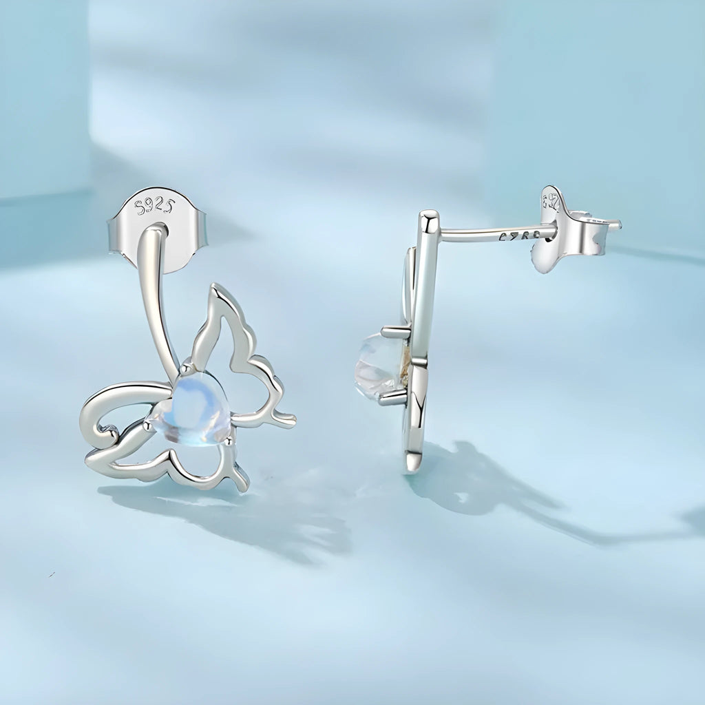 925 silver butterfly stud earrings with moonstone inlay on a white background