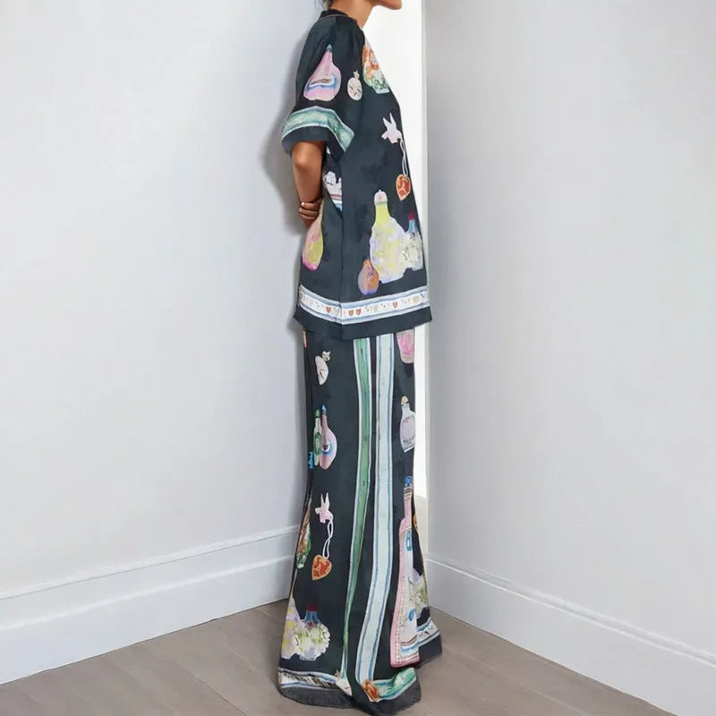 Black women's casual set with cartoon print, featuring a cardigan and trousers