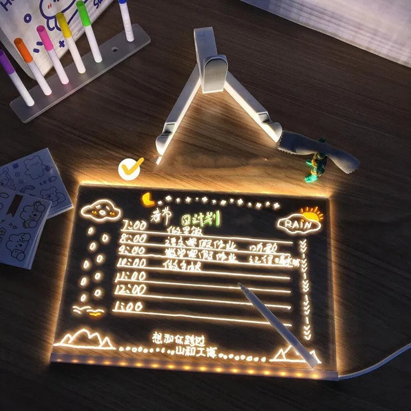 Acrylic DIY note board LED night light with pens on desk, showing written message and soft glow