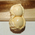 Solid bamboo carved peanut ornament with modern simplicity style and symbolic message.