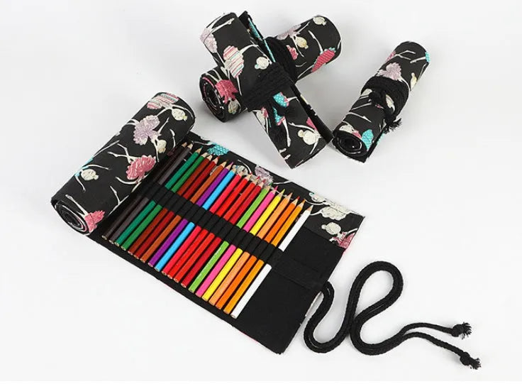 Square canvas pencil case with ballet girl print, showing multiple holes for organising pencils and stationery.