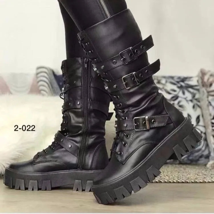 Women's black knee-high boots with metal buckle straps and a side zipper closure.