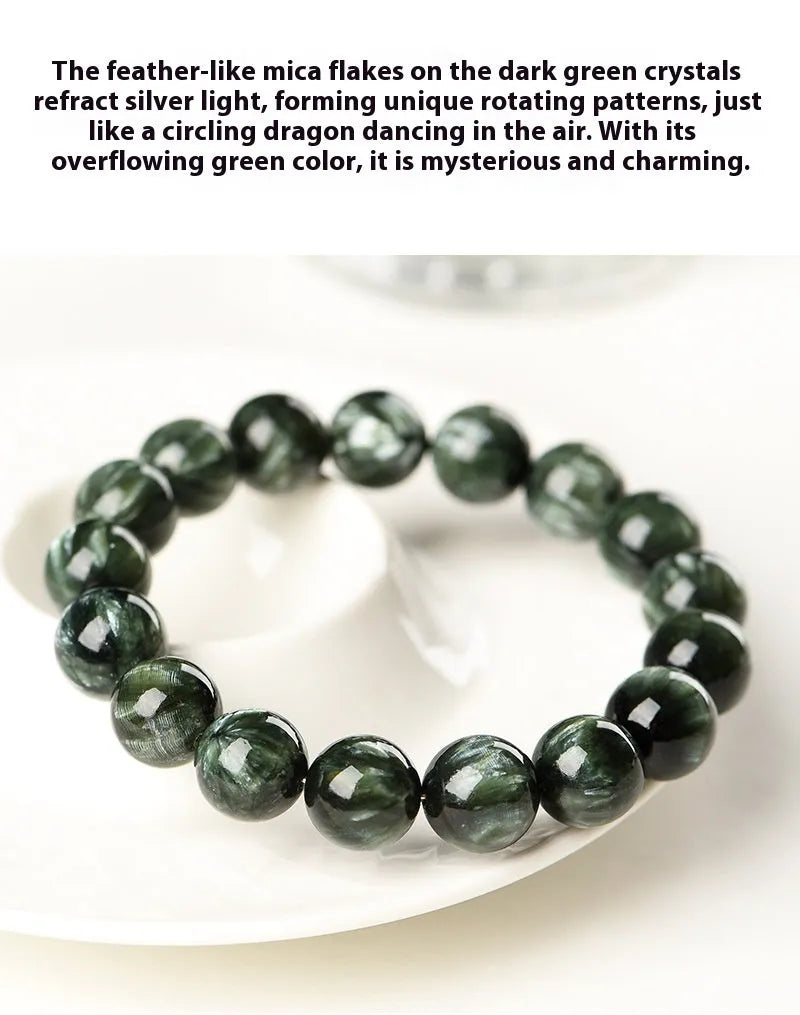 Natural green dragon crystal round bead bracelet with ruyi design on a wrist.