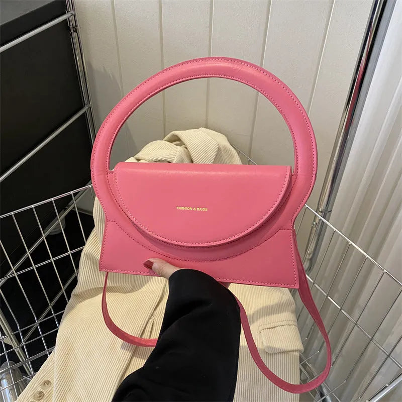 PU leather messenger bag in horizontal square shape with phone compartment and stitching detail