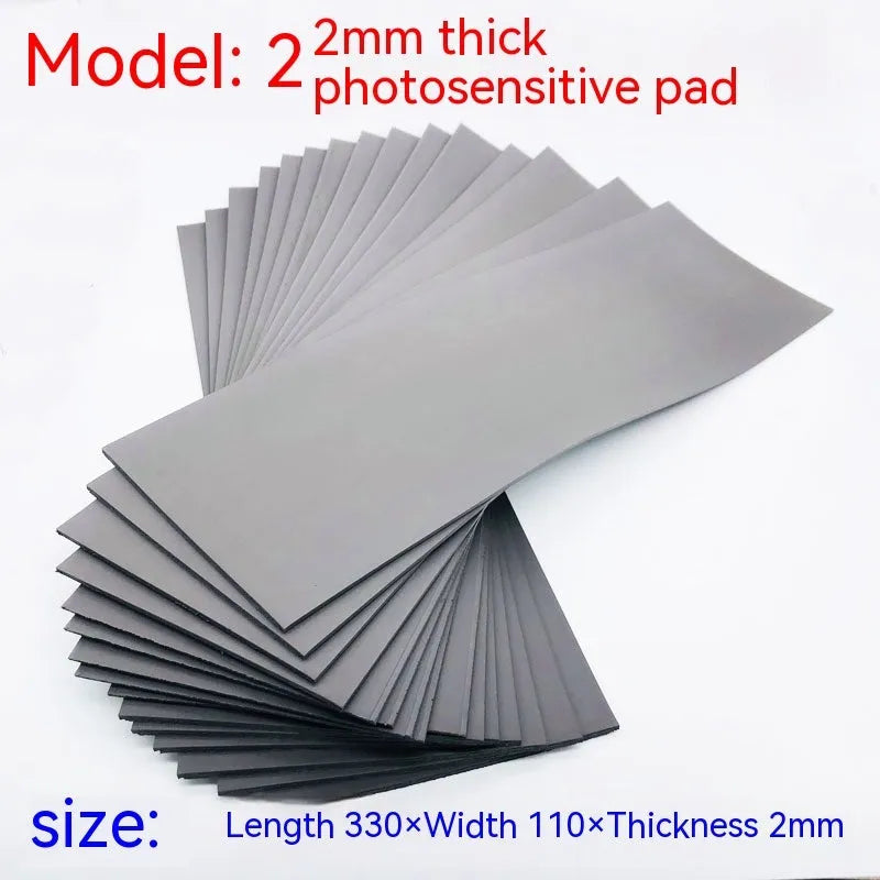 Black and grey plastic light-sensitive seal mat for pottery and calligraphy, 330mm by 110mm.