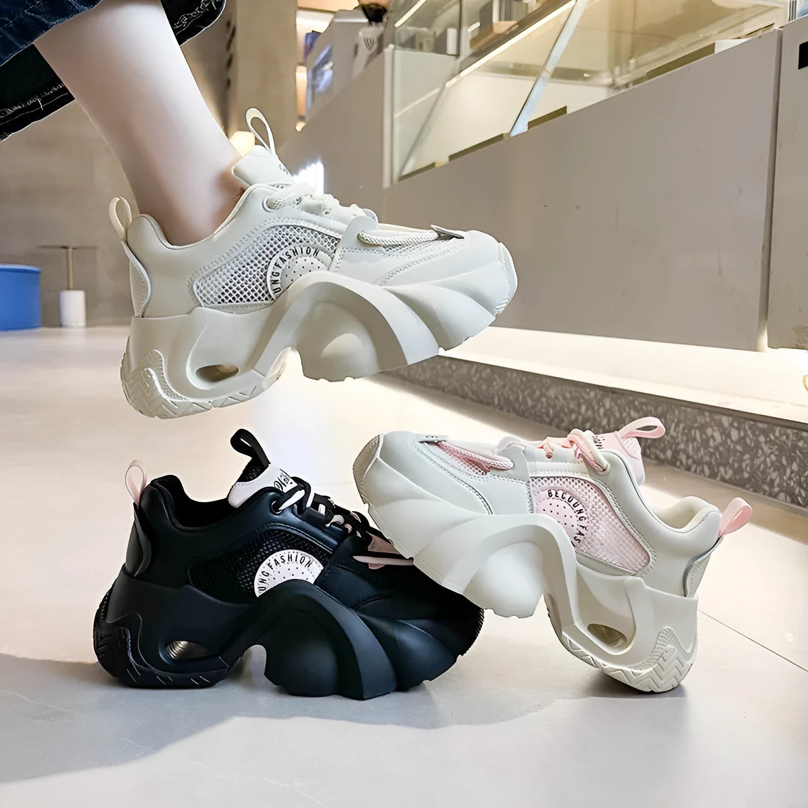 Women's thick sole sneakers with crossover strap detail in pink, black, and beige colour options