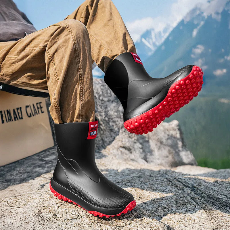 Men's mid low tube rain boots with non-slip sole and PVC upper in black