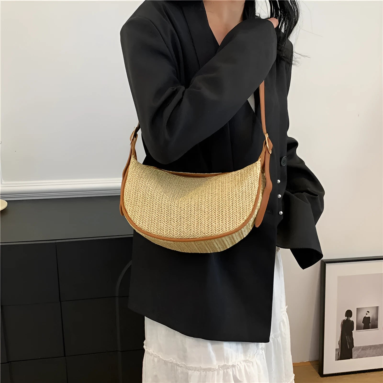 Women's knitted straw woven crossbody bag showing woven texture and internal phone and document pockets