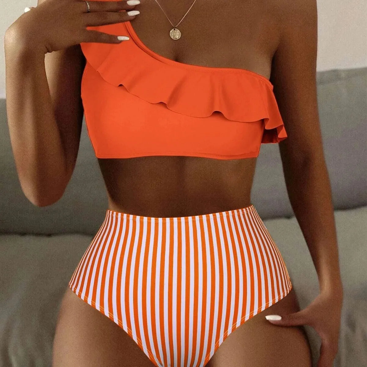 Striped split bikini women's swimsuit in solid colour, two piece, triangle top, cheeky bottom, high cut sides.