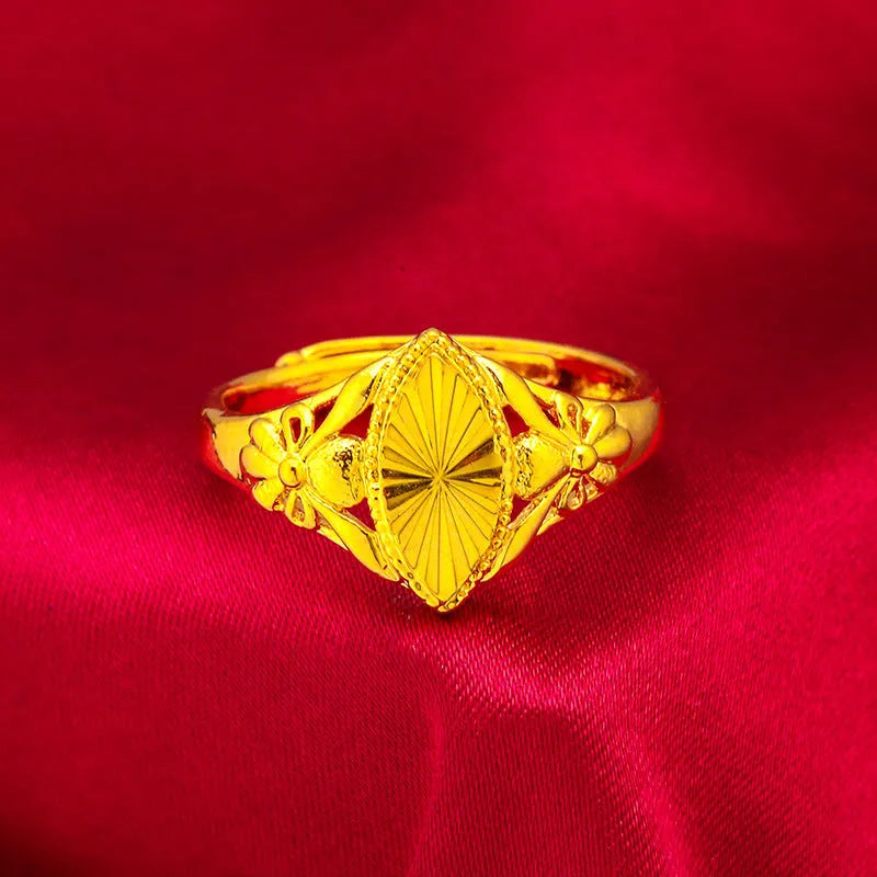 Alluvial gold electroplated brass ring with open diamond floral geometric design and textured band